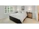 Bright bedroom with plush carpet, large window, and contemporary decor at 767 Roslyn St # 20, Denver, CO 80230