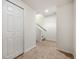 Bright hallway with tiled floors, closet, and a staircase leading to the upper level at 767 Roslyn St # 20, Denver, CO 80230