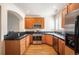 Updated kitchen featuring wood cabinets, granite counters, and stainless steel appliances at 767 Roslyn St # 20, Denver, CO 80230