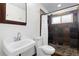 Updated bathroom with a tiled walk-in shower, modern fixtures, and a stylish vanity at 47 S Hazel Ct, Denver, CO 80219