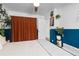 Stylish bedroom with accent wall, hardwood floors, and natural light at 47 S Hazel Ct, Denver, CO 80219