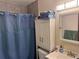 Practical bathroom featuring a shower, toilet, and vanity with good lighting at 1778 S Lee St, Lakewood, CO 80232