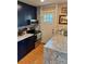 Charming kitchen featuring a tiled backsplash, granite countertops, and stainless steel appliances at 1778 S Lee St, Lakewood, CO 80232