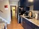 Nicely appointed kitchen featuring stainless steel appliances, granite countertops and dark wood cabinets at 1778 S Lee St, Lakewood, CO 80232