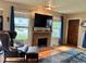 Inviting living room with brick fireplace, wood floors, and comfortable seating at 1778 S Lee St, Lakewood, CO 80232