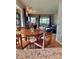 Open concept living area featuring hardwood floors, a dining table, and an inviting leather sofa at 1778 S Lee St, Lakewood, CO 80232