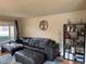Spacious living room featuring a comfortable sectional sofa and stylish decor at 1778 S Lee St, Lakewood, CO 80232