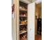 Well-stocked pantry with ample shelving and a variety of food items, perfect for organization at 1778 S Lee St, Lakewood, CO 80232