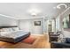 Primary bedroom features hardwood floors, recessed lighting, and a view of the ensuite bathroom at 395 N Franklin St, Denver, CO 80218