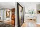 Hallway view of an elegant home with hardwood floors and trim leading to the kitchen at 395 N Franklin St, Denver, CO 80218