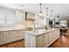 Bright kitchen with a marble countertop island, stainless steel appliances, and pendant lighting at 395 N Franklin St, Denver, CO 80218