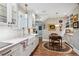 Eat-in kitchen nook with tile backsplash, hardwood floors, and white cabinets at 395 N Franklin St, Denver, CO 80218