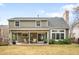 Back exterior of home showcasing patio and yard at 5951 E Irish Pl, Centennial, CO 80112