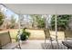 Backyard patio with outdoor chairs and string lights overlooking a spacious yard at 5951 E Irish Pl, Centennial, CO 80112