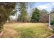 Expansive backyard with mature trees and a swing set at 5951 E Irish Pl, Centennial, CO 80112