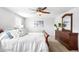 Comfortable bedroom features plush carpet, a ceiling fan, and plenty of natural light from the window at 5951 E Irish Pl, Centennial, CO 80112