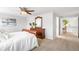 Spacious bedroom features carpet, a ceiling fan, and lots of natural light from the window at 5951 E Irish Pl, Centennial, CO 80112