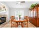 Inviting dining room features hardwood floors, fireplace, and a large window to the outdoor space at 5951 E Irish Pl, Centennial, CO 80112