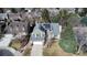Aerial view of home featuring solar panels, an attached two car garage, and mature trees at 5951 E Irish Pl, Centennial, CO 80112