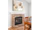 Close-up of brick fireplace in the dining and living area at 5951 E Irish Pl, Centennial, CO 80112