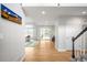 Bright foyer featuring wood floors, a staircase, and access to the living areas at 5951 E Irish Pl, Centennial, CO 80112