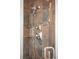 Close-up of the tiled shower with a rainfall shower head and shampoo nook at 5951 E Irish Pl, Centennial, CO 80112