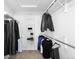 Bright walk-in closet with storage racks, clothing rods, and carpeted flooring at 5951 E Irish Pl, Centennial, CO 80112