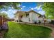 Beautiful backyard with a well-maintained lawn and partial fencing at 5372 W 68Th Ave, Arvada, CO 80003