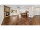 Spacious open-concept living room with a stone fireplace and hardwood floors at 5372 W 68Th Ave, Arvada, CO 80003
