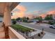 Neighborhood street view from the porch featuring well-kept lawns and charming homes at sunset at 5372 W 68Th Ave, Arvada, CO 80003
