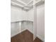 Organized walk-in closet featuring ample shelving and chrome bars for storage at 5372 W 68Th Ave, Arvada, CO 80003