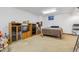 Spacious basement area with carpet, a large bed, and wooden storage units at 8836 E Phillips Pl, Centennial, CO 80112