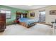 Comfortable bedroom with a decorative wooden headboard and ample natural light at 8836 E Phillips Pl, Centennial, CO 80112