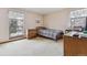 Cozy bedroom featuring natural light, neutral carpet, and standard closet at 8836 E Phillips Pl, Centennial, CO 80112