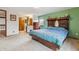 Spacious main bedroom features a decorative headboard and ample closet space at 8836 E Phillips Pl, Centennial, CO 80112