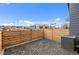 Modern home exterior with patio, gray pavers, gray siding, and stone accents at 9468 W 58Th Ln # C, Arvada, CO 80002