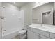 A full bathroom featuring modern fixtures, a tub with shower, and a bright vanity at 9468 W 58Th Ln # C, Arvada, CO 80002