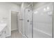 Bright bathroom featuring a glass enclosed shower, modern fixtures, and neutral color palette at 9468 W 58Th Ln # C, Arvada, CO 80002