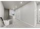 Well-lit hallway with plush carpet, white doors, and staircase access at 9468 W 58Th Ln # C, Arvada, CO 80002