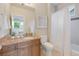 Well-lit bathroom with a granite vanity, tile floors, and a tub shower, offering functionality and style at 3858 W 117Th Ct, Westminster, CO 80031