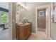 Stylish bathroom features a granite countertop, wood cabinetry, and a tiled walk-in shower at 3858 W 117Th Ct, Westminster, CO 80031
