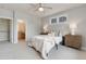 Bright bedroom featuring an ensuite bathroom, plush carpet, and modern decor for a relaxing living space at 3858 W 117Th Ct, Westminster, CO 80031