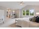 Bright bedroom with large windows, neutral tones, and plush carpeting for a cozy and inviting space at 3858 W 117Th Ct, Westminster, CO 80031