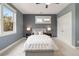Comfortable bedroom with neutral tones, plush carpet, and large windows at 3858 W 117Th Ct, Westminster, CO 80031