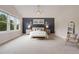 Spacious bedroom featuring large windows, a ceiling fan, and elegant decor for a relaxing retreat at 3858 W 117Th Ct, Westminster, CO 80031