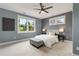 Comfortable bedroom with neutral tones, plush carpet, and large windows at 3858 W 117Th Ct, Westminster, CO 80031