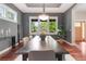Bright dining room featuring wood floors and large windows overlooking the outdoor area at 3858 W 117Th Ct, Westminster, CO 80031