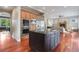 Modern kitchen island open to living area featuring stainless steel appliances at 3858 W 117Th Ct, Westminster, CO 80031