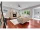 Cozy living room with a modern fireplace, hardwood floors, and comfortable seating at 3858 W 117Th Ct, Westminster, CO 80031