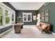 Comfortable office with ample natural light, a modern desk, and a stylish leather sofa at 3858 W 117Th Ct, Westminster, CO 80031